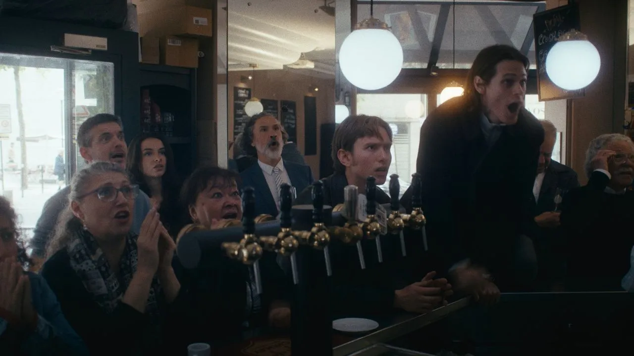 Group gathered around the counter in a busy cafe.